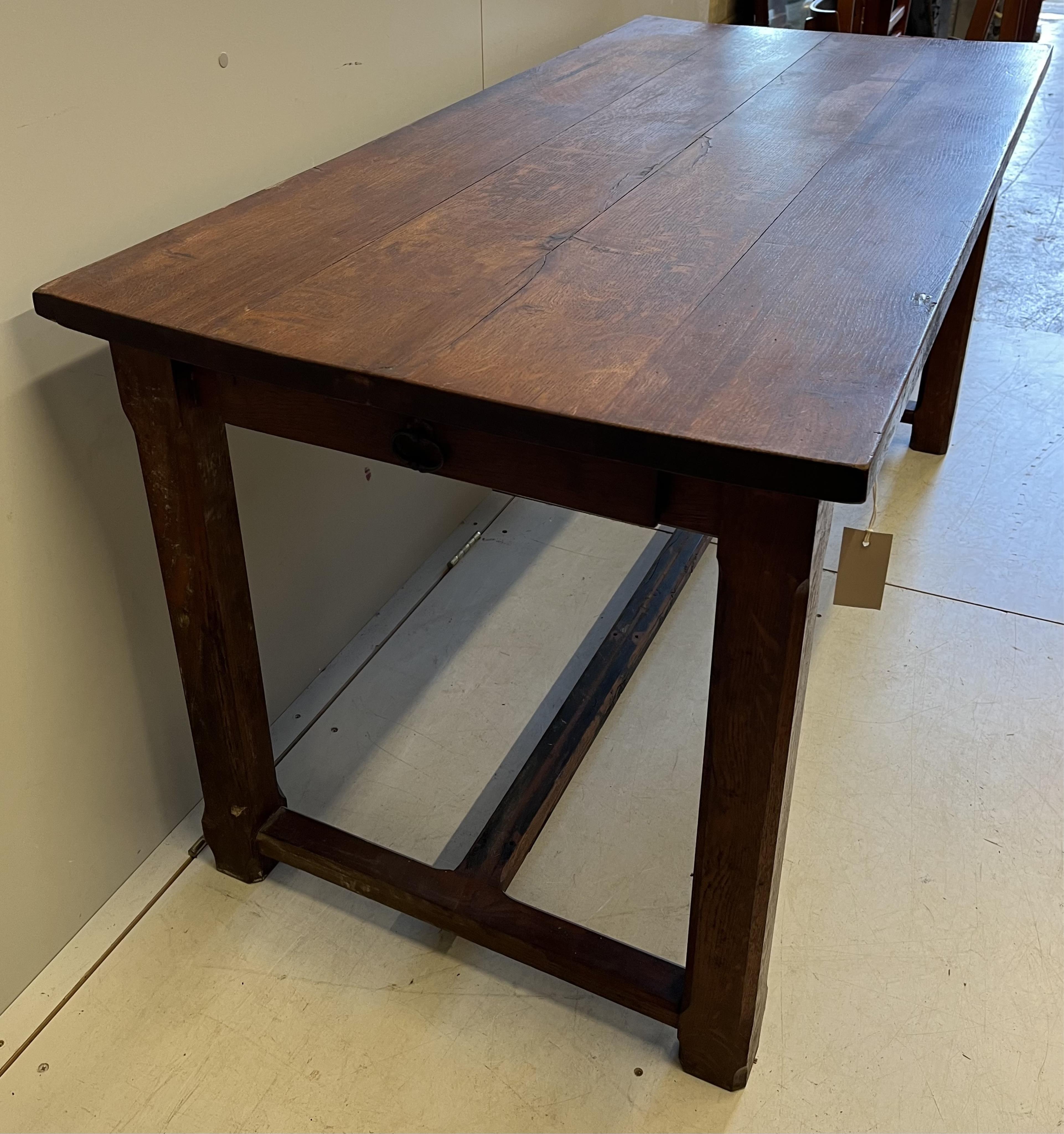 An early 20th century French rectangular oak kitchen table, on chamfered square legs, width 159cm, depth 74cm, height 76cm